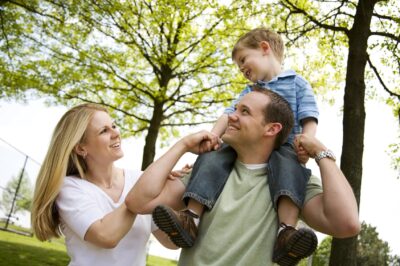 West Auckland dentist, family smiling in park