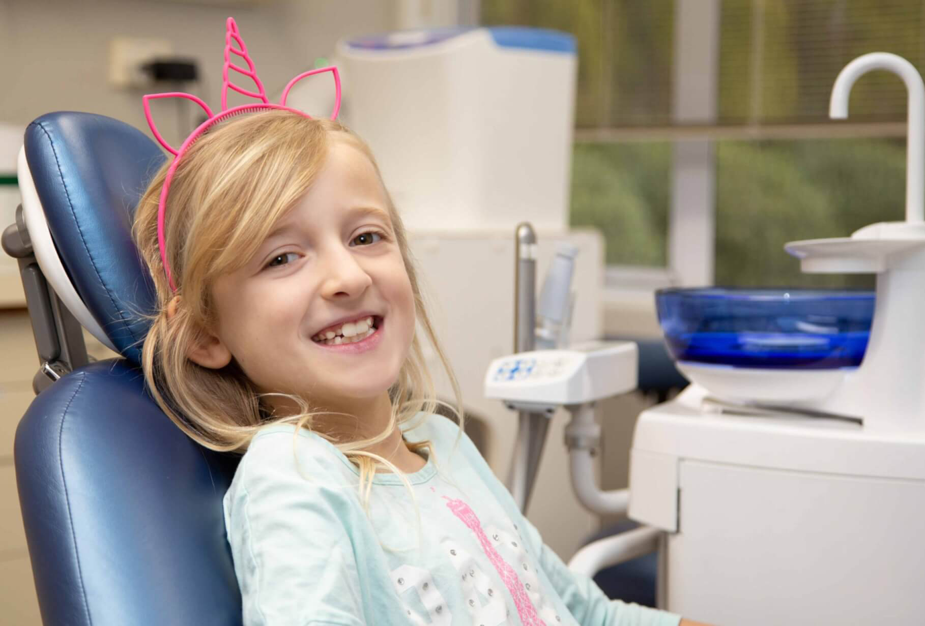 orthodontics for kids, girl in dentist chair