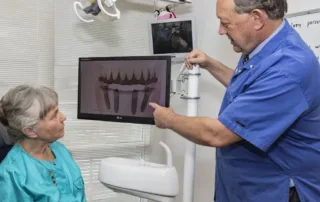 questions to ask before getting a dental implant, patient and implant dentist