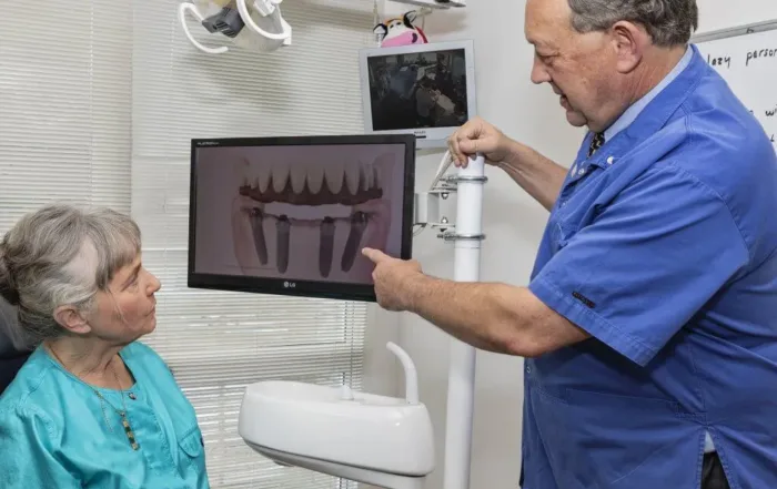 questions to ask before getting a dental implant, patient and implant dentist