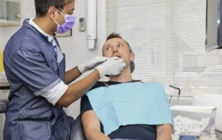 reasons why you should see your dentist every 6 months, dentist and patient