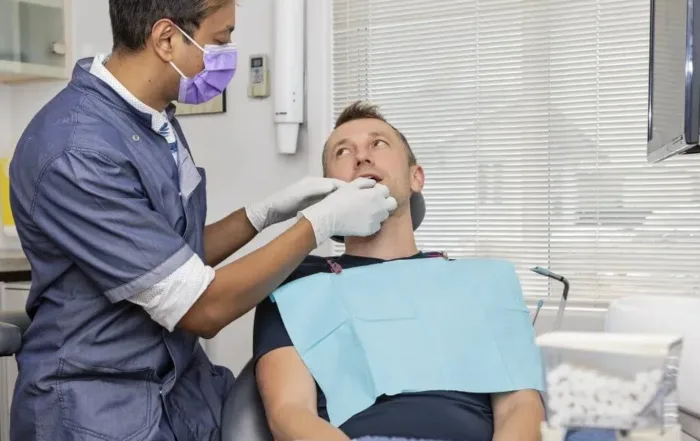 reasons why you should see your dentist every 6 months, dentist and patient